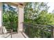 Balcony featuring a metal railing and views of lush greenery at 11 Perimeter E Ctr # 1412, Atlanta, GA 30346
