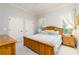 Bright bedroom with wood bed frame, carpet, and windows featuring a peaceful retreat for relaxation and restful sleep at 11 Perimeter E Ctr # 1412, Atlanta, GA 30346