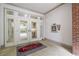Elegant entrance features double doors, tiled floors, and signage for The Prescott at Park Place Condominium at 11 Perimeter E Ctr # 1412, Atlanta, GA 30346