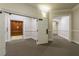 Hallway with elevator, neutral carpet, classic trim, and access to apartments and common areas at 11 Perimeter E Ctr # 1412, Atlanta, GA 30346