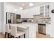 Bright kitchen features stainless appliances, marble countertops, and white cabinetry at 11 Perimeter E Ctr # 1412, Atlanta, GA 30346