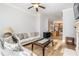 Bright living room with hardwood floors, neutral walls, open layout to kitchen, and comfortable furnishings for relaxation at 11 Perimeter E Ctr # 1412, Atlanta, GA 30346