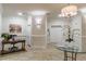 Inviting lobby area with tiled floors, a small table, a desk, an elevator, and elegant decor at 11 Perimeter E Ctr # 1412, Atlanta, GA 30346