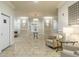 Elegant lobby with travertine floors, stylish furnishings, designer lighting, and neutral color palette, exuding sophistication and comfort at 11 Perimeter E Ctr # 1412, Atlanta, GA 30346