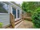 Exterior view of the home featuring a back porch, stairs and double doors at 135 Pheasant Se Dr, Marietta, GA 30067
