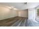 Spacious bedroom with neutral walls, wood-look floors, a double door closet, and natural light from windows at 135 Pheasant Se Dr, Marietta, GA 30067