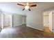 Bedroom featuring laminate floors, ceiling fan, and two large closets at 135 Pheasant Se Dr, Marietta, GA 30067