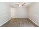 Bedroom showcasing laminate floors and wainscoting at 135 Pheasant Se Dr, Marietta, GA 30067