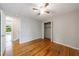Bedroom showcasing hardwood floors, a ceiling fan, and closet space at 135 Pheasant Se Dr, Marietta, GA 30067