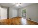 Bedroom with hardwood floors, closet, a ceiling fan, and window at 135 Pheasant Se Dr, Marietta, GA 30067