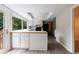 Bright kitchen features white cabinets, stainless steel appliances, skylights, and a large window overlooking trees at 135 Pheasant Se Dr, Marietta, GA 30067