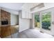 Kitchen featuring white cabinets and a sliding glass doors that lead to backyard at 135 Pheasant Se Dr, Marietta, GA 30067