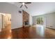 Spacious living room with brick fireplace, ceiling fan, hardwood floors and door to patio at 135 Pheasant Se Dr, Marietta, GA 30067