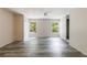 Open living room featuring neutral walls, wood-look floors, bright windows and natural light, and closet storage at 135 Pheasant Se Dr, Marietta, GA 30067