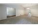 Inviting living room offers neutral tones, plush carpet and direct access to the hallway at 135 Pheasant Se Dr, Marietta, GA 30067