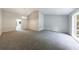 Spacious living room with neutral carpet and wainscotting at 135 Pheasant Se Dr, Marietta, GA 30067
