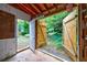Interior view of shed looking out to wooded backyard at 135 Pheasant Se Dr, Marietta, GA 30067