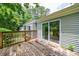 Exterior view of the home featuring sliding doors onto a wooden deck at 135 Pheasant Se Dr, Marietta, GA 30067