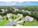A high aerial view showcases well-maintained homes in a lush, green neighborhood at 1709 Grove Se Ct, Conyers, GA 30013