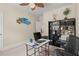 Bright bedroom featuring a ceiling fan, white walls and desk at 1709 Grove Se Ct, Conyers, GA 30013