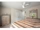 Well-appointed bedroom with matching dressers, closet, and ceiling fan for added comfort at 1709 Grove Se Ct, Conyers, GA 30013