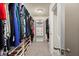 Walk-in closet with custom shelving and ample storage space for clothes and shoes at 1709 Grove Se Ct, Conyers, GA 30013