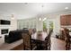 Dining area open to living room with view to deck at 1709 Grove Se Ct, Conyers, GA 30013