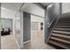 Open-concept entryway with hardwood-style floors leads into the living area and showcases the staircase at 1709 Grove Se Ct, Conyers, GA 30013