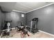 Basement exercise room featuring work-out equipment and bright, neutral walls at 1709 Grove Se Ct, Conyers, GA 30013