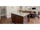 Spacious kitchen island with hardwood floors and granite countertops at 1709 Grove Se Ct, Conyers, GA 30013