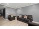 Well-lit living room offers comfortable seating and modern flooring at 1709 Grove Se Ct, Conyers, GA 30013