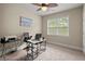 Bright office space with neutral walls, carpet flooring, and a large window for natural light at 1709 Grove Se Ct, Conyers, GA 30013