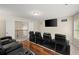 Home theater with comfortable seating, a large screen, and rich wood accents at 1709 Grove Se Ct, Conyers, GA 30013