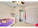 Bedroom showcasing neutral walls, a ceiling fan, and a closet at 1870 Milfield Cir, Snellville, GA 30078