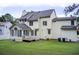 Spacious backyard with an exterior view of the home, featuring a screened-in porch at 1870 Milfield Cir, Snellville, GA 30078