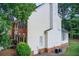 View of the side of a brick and siding home, showing architectural details at 1870 Milfield Cir, Snellville, GA 30078