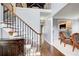 Beautiful staircase and foyer with hardwood floors and decorative furnishings at 1870 Milfield Cir, Snellville, GA 30078