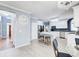 Modern kitchen with white cabinets, stainless steel appliances, and a center island with seating at 1870 Milfield Cir, Snellville, GA 30078
