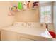 Laundry room with white appliances, a window, and storage shelf at 1870 Milfield Cir, Snellville, GA 30078