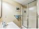 Cozy bathroom featuring a clear sink, vanity and enclosed shower at 7310 Ne Wynhill Ne Dr, Atlanta, GA 30328