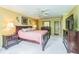Spacious bedroom with carpet, ceiling fan, and matching furniture set, including bedside tables and a dresser at 7310 Ne Wynhill Ne Dr, Atlanta, GA 30328