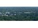 Expansive aerial view of a lush, green landscape with scattered buildings on the horizon at 855 Peachtree Ne St # 2913, Atlanta, GA 30308