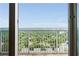 Balcony offering a view of the city skyline and mature tree canopy at 855 Peachtree Ne St # 2913, Atlanta, GA 30308