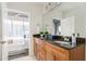 Bathroom offers a double vanity with a granite countertop and a view into the modern bedroom at 855 Peachtree Ne St # 2913, Atlanta, GA 30308