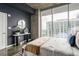 Stylish bedroom with a modern design, comfortable bed, and a large window framing a beautiful city view at 855 Peachtree Ne St # 2913, Atlanta, GA 30308