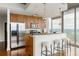 Modern kitchen features stainless steel appliances, breakfast bar, and stunning city views at 855 Peachtree Ne St # 2913, Atlanta, GA 30308