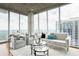 Bright living room featuring floor-to-ceiling windows and contemporary decor at 855 Peachtree Ne St # 2913, Atlanta, GA 30308