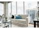 Modern living room showcasing a comfortable sofa and an expansive window view at 855 Peachtree Ne St # 2913, Atlanta, GA 30308