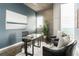 Modern office space with glass table, accent chairs, and concrete wall feature at 855 Peachtree Ne St # 2913, Atlanta, GA 30308