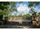 Picturesque public space with an old stone stage, framed by greenery and a distant cityscape backdrop at 855 Peachtree Ne St # 2913, Atlanta, GA 30308
